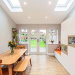 Interior of the dining room extension with Velux sky lights and double glazed French doors.