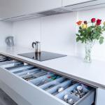 the same drawers with top one opened to show ample storage for cutlery and utensils