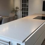 Large island with easy to clean Tristone worktop.