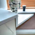 Detail of the Corian® stepping down from the worktop to create a ledge that meets the window sill.