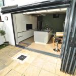 New fitted kitchen in Lytham with bi-fold doors and centre island