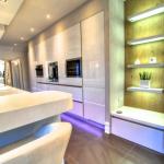 Gloss white tall units with Miele appliances