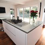 centre island with hob. bifold doors.