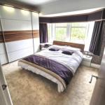 Matching the bed and bedside tables to the sliding wardrobe doors
