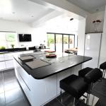 fitted kitchen with large island and breakfast bar