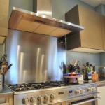 Stainless steel range cooker, splashback and extractor