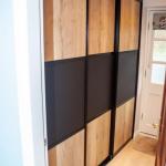 Full height co-ordinating sliding doors fitted in adjacent hallway to create large storage space.