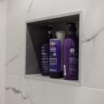 Tiled niche in the shower area for shampoo and shower gel