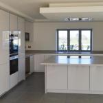handleless gloss Keller Kitchen with Corian worktops and Seimens appliances