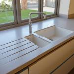 Corian worktops with moulded sinks.