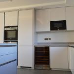 handleless gloss Keller Kitchen with Corian worktops and Seimens appliances