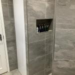 tiled niche in the shower area to hold products for convenient use