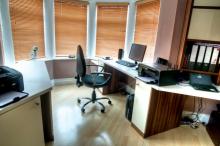 Home office with custom-made Corian® worktops to provide a seamless work area tailored to requirements