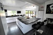 new fitted kitchen with large centre island handleless style