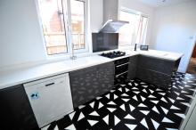 Keller fitted kitchen featuring Corian Neff and Amtico products