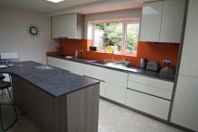 Keller high gloss handleless fitted kitchen with Formica laminated tops