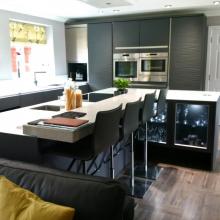 Keller fitted kitchen featuring glass and quartz stone worktops