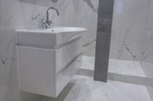 White vanity unit with drawers, curved basin and polished chrome tap 